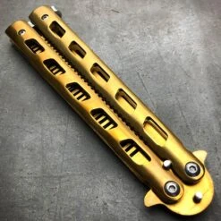 GOLD Butterfly Balisong Trainer Knife Training Comb Blade Stainless Practice 21 GOLD Butterfly Balisong Trainer Knife Training Comb Blade Stainless Practice -BLADE ADDICT Sales blade addict butterfly knife gold butterfly balisong trainer knife training comb blade stainless practice 21537711161543